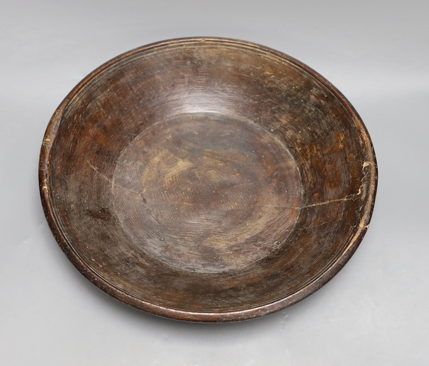 A 19th century wooden mazer, 40cm diameter